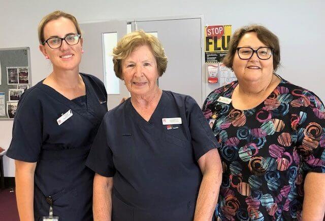 Barbara Carroll (centre) has reached an amazing 63 years of service recently. She has spent 43 years of those being with the Western NSW Local Health District. Image Credit: Western NSW Local Health District Facebook Page.