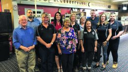 L-R: Ray Longfellow, Greg Edwards, Warren Smith, Robyn McMasters, Faye Johnson, Annette Elliott, Marie Kelly, Joan (Slade), Andrew Godfrey, Louise Miller, and Deb Stokes. Source and Image Credits: Ivanhoe Central School’s Newsletter.