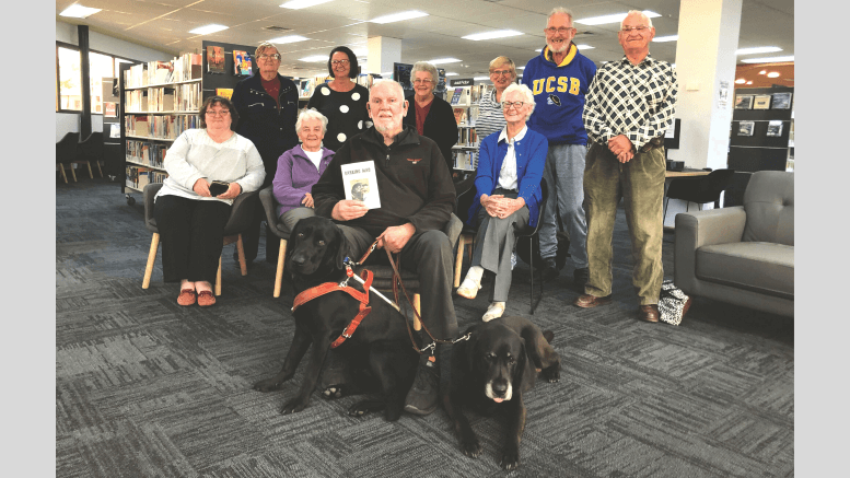 Ross Fitzell with Harry (right) and Pluto and the delighted audience at West Wyalong Library. Source and Image Credit: Tom Gosling