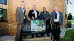 Private Garry Lewis, Cpl Graeme Yetman, President of the Condobolin RSL Club Michael Wighton and Private James Stewart with the special ‘Lament for the dead of Long Tan’ photograph that was presented to the members of the Condobolin RSL Sub Branch on ANZAC Day (25 April). Image Credit: Kathy Parnaby.