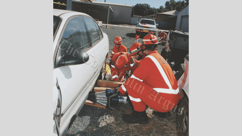 SES volunteers training with the Jaws of Life to lift a car off a patient. They have 30 minutes to get them out and into an ambulance. Image Credit: Kathy Parnaby.