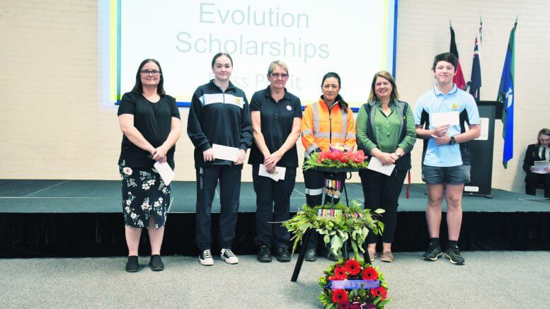 Rachel Waller (accepting on behalf of daughters Laura and Madeleine), Mia Noll (accepting on behalf of her sister Lara), Michelle Whiley (accepting on behalf of her daughter Linzi), Evolution Mining Community and External Relations Officer, Renee Pettit, Lindy Moon (accepting on behalf of Will Coleman) and Matthew Brasnett (accepted on behalf of his sister Jessica). Image Credit: Melissa Blewitt.
