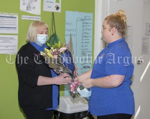 Alese Keen (right) gives Rachel Brook a beautiful bunch of flowers at her farewell.
