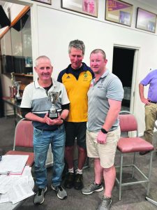 A Grade winners Micko Skinner holding their trophy (Left) and Adam Hill (Right) with  Terry Galvin (Centre).