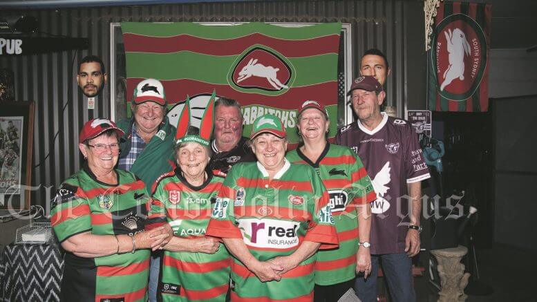 Rabbitohs supporters Fay Krebs, Len Krebs, Anne O’Hara, Kenny King, Jean Ticehurst, Sue O’Hara and Allan O’Hara may have been dispapointed with the 2021 Rugby League Grand Final result but remain loyal to the thier Club of choice. Image Credit: Kathy Parnaby.