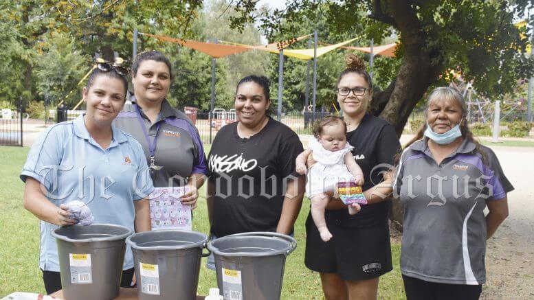 CatholicCare Wilcannia-Forbes Family Support Worker Jackie Coe, Becky Merritt (Marathon Health), Condobolin SHINE Women’s Group member Teigan McCrae, Condobolin SHINE Women’s Group member Madeline Richards holding Kailani Richards and Marathon Health Peer Worker Anita Johnson were involved in a ‘Tie Dye in the Park’ event on Tuesday, 9 November. Image Credit: Melissa Blewitt.