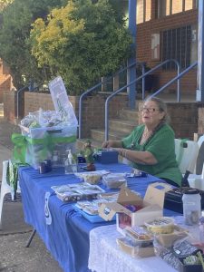 CWA member Claire at the stall selling baked goods.