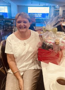 Connie Venables won the lucky door prize, which was donated by Florist la Fleur. Image Credit: Susan Bennett.