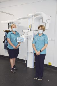 Radiographer/trainee Sonographer Melissa Thorpe and Chief Radiographer/Sonographer Janine Slade showcase the new Orthopantomogram (OPG) and Lateral Cephalometric X-ray machine (Lat Ceph) at Condobolin Health Service. Image Credit: Melissa Blewitt.