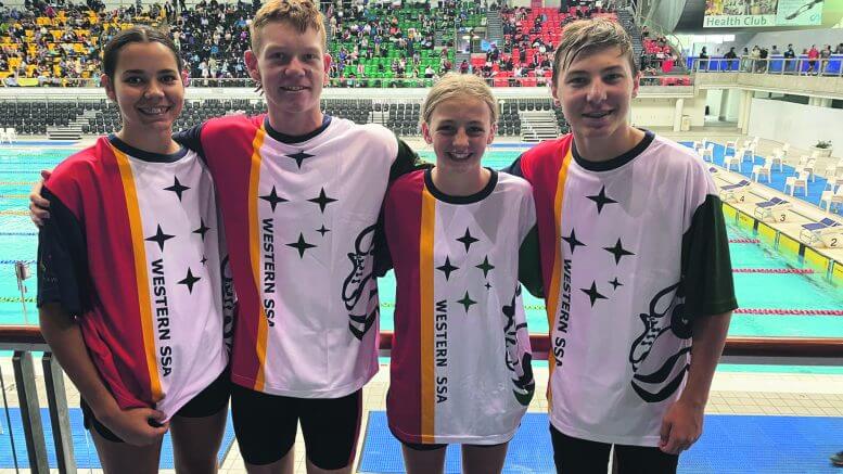 Aliethea Stokes, William Taylor, Jessica Morgan and Harry Budd wearing their special shirts from Western Schools Sport Association.