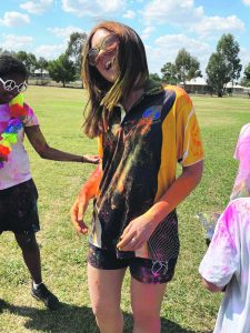 It was Miss Corcoran’s birthday on the day. She was attacked with the bright colours by fellow staff and students.