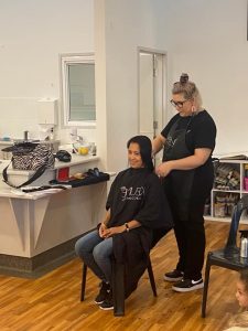 Zoe Lark, from Gallery 104, had the honour of cutting Leilane Donaire’s hair for charity. Image Credit: Condobolin Preschool and Childcare Facebook Page.