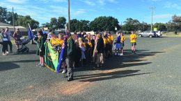 Tullibigeal Central School's School Captains followed by students during the march.