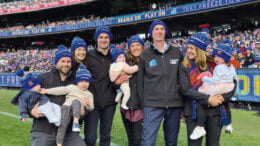 Neale Daniher (eighth from left) with his family at the Melbourne Cricket Ground (MCG) on Monday, 13 June. They were there to witness the “Big-Freeze at the G” charity event, which raises funds and awareness of Motor Neurone Disease (MND). Image Credit: AFL Facebook Page.