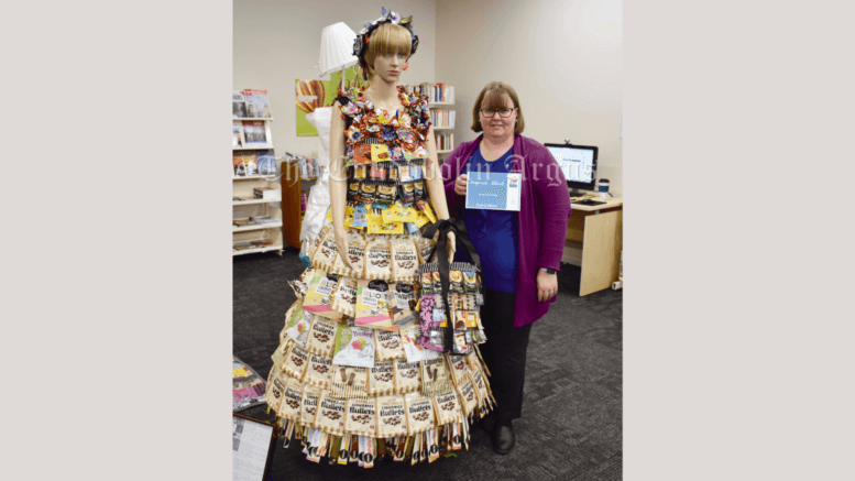 Lachlan Shire Library Assistant Abby Grimshaw with Terryll Cassidy’s ‘Liquorice Allsorts’, which was named the winner of the Lachlan Shire’s 2022 Waste 2 Art Competition. Image Credit: Melissa Blewitt;
