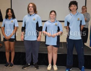  In Year Eight, the SRC representatives are Kiara Roussety, Jonah Grimshaw, Maddi Scarce and Triston Ross. Principal Wendy Scarce (background) presented the SRC badges. Image Credit: Melissa Blewitt.