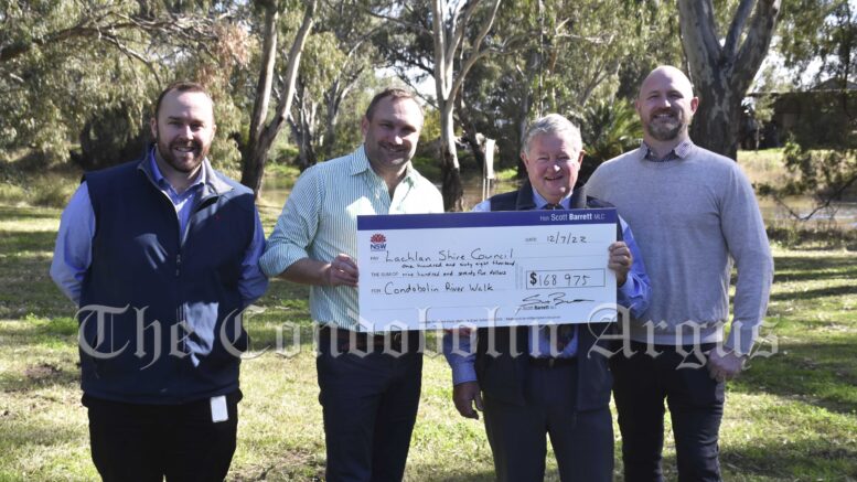 NSW Nationals Upper House member Scott Barrett (second from left) presented Lachlan Shire Council with $168,975 funding under the NSW Government’s Stronger Country Communities Fund for the construction of the Condobolin River Walkway initiative on Tuesday, 12 July. Lachlan Shire Council’s Director Environment Tourism and Economic Development Jon Shillito, Lachlan Shire Mayor John Medcalf OAM, Lachlan Shire Council’s Manager Urban Works Baden Hall were on hand to discuss the project. Image Credit: Melissa Blewitt.