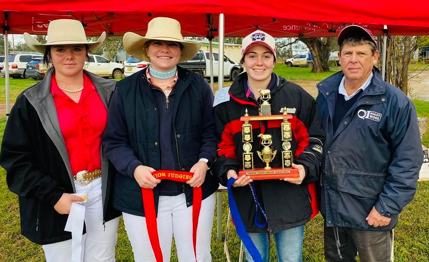 Placegetters in the Senior Wool section at last year’s event, Claudia McConnaughty (third), Georgia Briggs (second) and Arabella Blewitt of Condobolin (first) with Steve Chester from Quality Wool. Image Credit: Penny Heuston via the Trangie Junior Judging Day Facebook Page.
