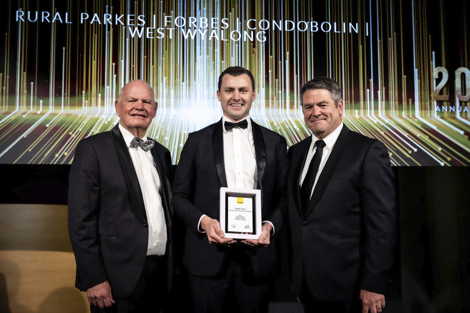 Paddy Ward (CENTRE), of Ray White Parkes, Forbes, Condobolin, West Wyalong, was ranked the number six salesperson in the country at the recent Ray White Rural annual awards. Image Contributed.