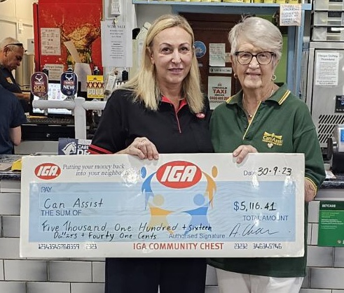Cristina Chamen presenting Robyn Ries with a cheque for Can Assist. Image Contributed.