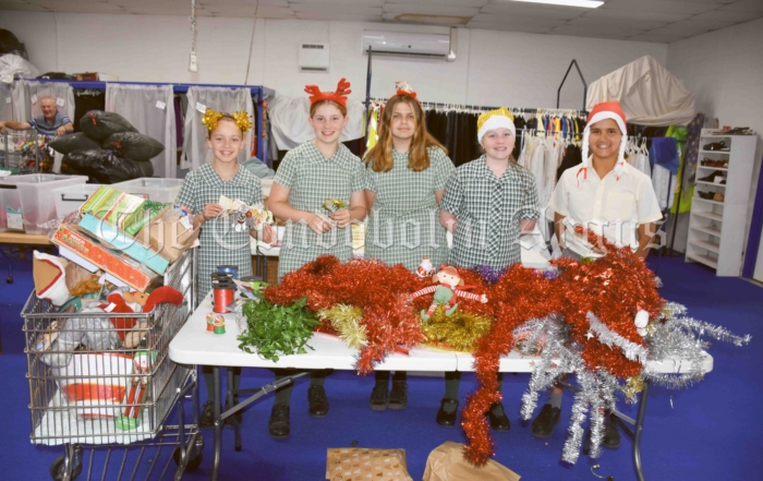 Abby Connell, Jaci Allen, Candace Dodgson, Charli Keates and Peter Elias were keen to help sort out Christmas goodies in the at St Vincent de Paul Society Condobolin Store, that will then be put up for sale. Image Credit: Melissa Blewitt.