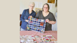 Fay Thornton and Denise Watt have created several sensory Fidget Blankets/Activity Mats for people living with dementia. They will donate them RSL LifeCare’s Robert White Retirement Village and William Beech Gardens in Condobolin. They are looking for more volunteers to be part of the community project. Image Credit: Melissa Blewitt.