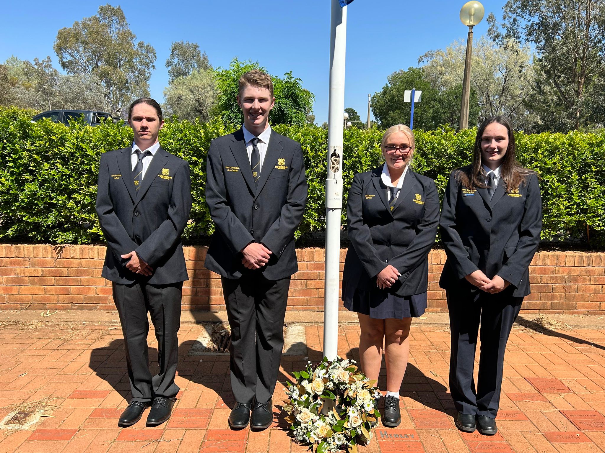 Condobolin High School Prefect Errol Packham, Condobolin High School Vice-Captain Sam Cunningham, Condobolin High School Captain Bella Clemson, and Condobolin High School Vice-Captain Kiera Stevenson took part in the School’s Remembrance Day Commemorative Service on Friday, 10 November. Image Credit: Condobolin High School Facebook Page.