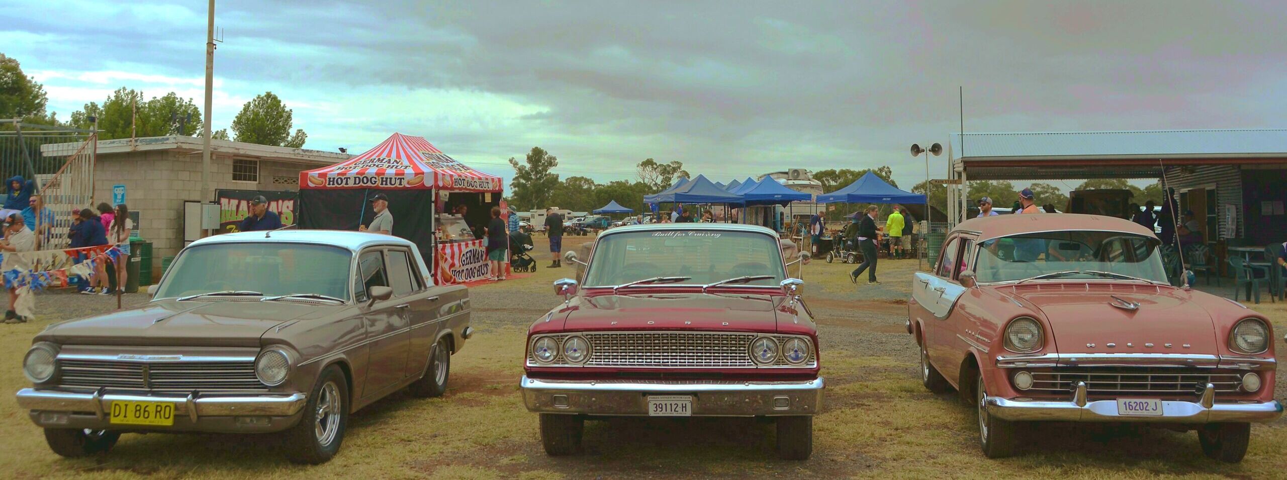 Grey skies did not keep the visitors away. This EH Holden, compact Fairlane and EK Holden attracted a lot of envious looks. Picture from David Ellery.